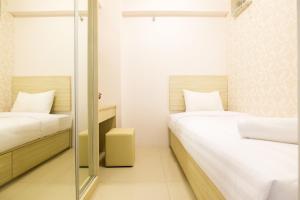 Easy Access to Mall 2BR Green Pramuka City Apartment By Travelio