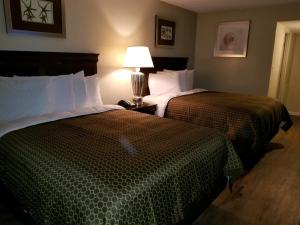 Two Queen Beds Kitchenette room in Ocean Waves Hotel