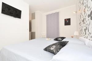 Two-Bedroom Apartment with Balcony and Sea View room in Apartments for families with children Seget Vranjica Trogir - 2976