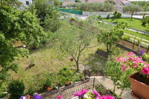 Three-Bedroom Apartment with Balcony room in Apartments with a swimming pool Poljica Zadar - 13838