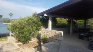 Stone house with a boat
