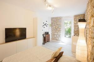 Appartements GregBnb-com - Studio CLIMATISE - Terrasse & parking prive : photos des chambres