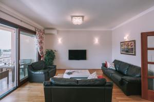 Two-Bedroom Apartment with Balcony and Sea View room in City Apartments