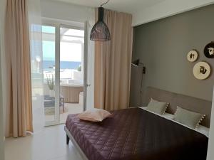 Attico con Vasca Idromassaggio e Vista Mare