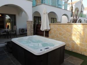 Deluxe One-Bedroom Suite with Outdoor Jacuzzi room in Caprice Spa Kosher Resort