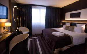 Hotels LE COLISEE Hotel & Spa NANTES Saint Herblain : photos des chambres