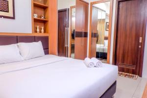 2BR Apartment Cozy Pool View Kemang Village with Access to Mall By Travelio