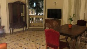 Historic 19th-Century Apartment with Balcony Overlooking Plaza