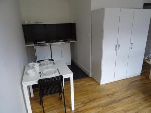 Appartements Au pied du Beffroi : photos des chambres