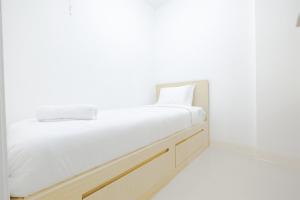 Simply & Clean 2BR Bassura City Apartment By Travelio