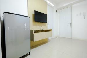Simply & Clean 2BR Bassura City Apartment By Travelio