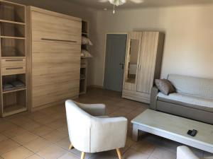 Appartements Aux pieds des arenes : photos des chambres