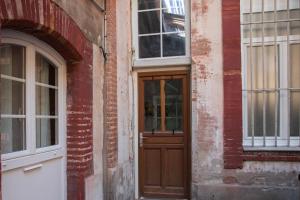 Appartements L'authentique - Coeur de ville : photos des chambres