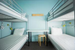 Single Bed in 4-Bed Female Dorm - Shared Bath room in HI - Seattle Hostel at the American Hotel