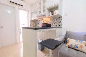 Minimalist 2BR Bassura Apartment Direct Access to Bassura City Mall By Travelio