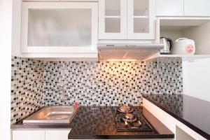 Minimalist 2BR Bassura Apartment Direct Access to Bassura City Mall By Travelio