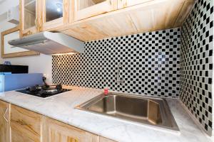 Comfortable 2BR at Bassura Apartment Near to Bassura City Mall By Travelio