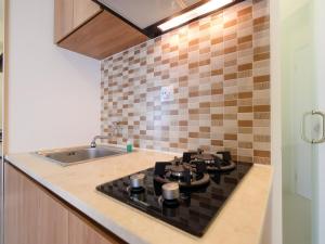 Modern Studio at Green Pramuka City Apartment near to Shopping Center By Travelio