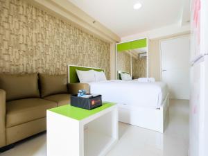 Modern and Minimalist Studio Bassura City Apartment By Travelio