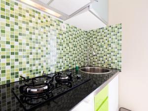 Modern and Minimalist Studio Bassura City Apartment By Travelio