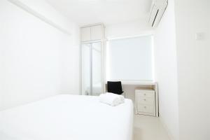 2BR Bassura City Apartment with City View By Travelio