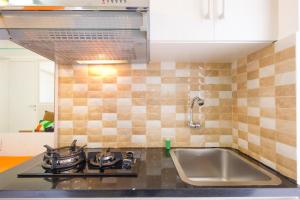 2BR City View Bassura City Apartment By Travelio