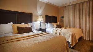 Queen Room with Two Queen Beds - Pool View room in Best Western Plus Pepper Tree Inn