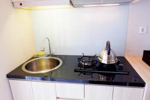 Cozy Studio at Bassura Apartment near to Bassura Mall By Travelio