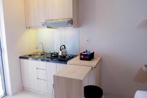 Cozy Studio at Bassura Apartment near to Bassura Mall By Travelio