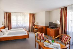 Triple Room room in INVITE Hotel Löwen Freiburg
