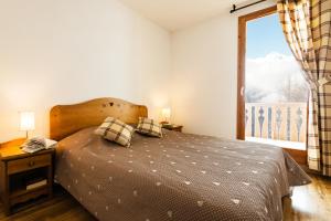 Appartements travelski home select - Residence L'Arollaie : photos des chambres