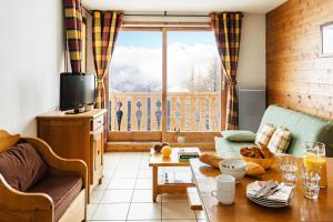 Appartements travelski home select - Residence L'Arollaie 4 stars : photos des chambres