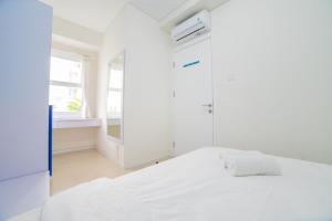 Cozy 2BR Apartment at Parahyangan Residence with Direct Access to Swimming Pool By Travelio