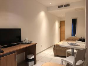 Family Room (2 Adults + 2 Children) with Free Airport Transfer room in Harbour Lodge