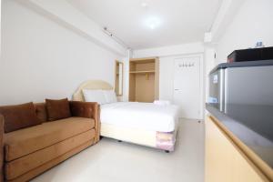 Affordable Studio with Sofa Bed at Bassura City Apartment By Travelio