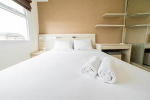 Modern 1BR Apartment Near Cihampelas at Parahyangan Residence By Travelio