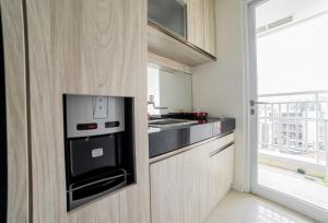 Modern 1BR Apartment Near Cihampelas at Parahyangan Residence By Travelio