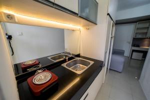 Contemporary 1BR Near Cihampelas at Parahyangan Residence Apartment By Travelio