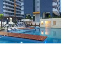 Apto pé-na-areia em Bertioga - Indaia Home Club