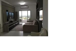 Apto pé-na-areia em Bertioga - Indaia Home Club