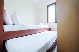 Cozy 2BR Bassura City Apartment By Travelio