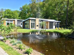 Modern chalet with a dishwasher, near a pond