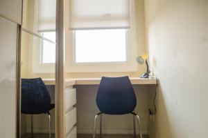 Compact 2BR with Sofa Bed at Parahyangan Residence By Travelio