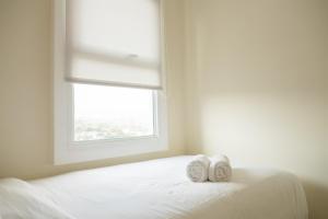 Compact 2BR with Sofa Bed at Parahyangan Residence By Travelio