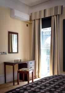 Signature Room room in The Windsor House Hotel