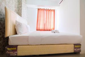 Cozy 2BR Bassura City Apartment with City View By Travelio