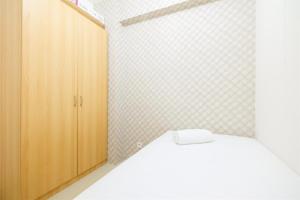 Cozy 2BR Bassura City Apartment with City View By Travelio