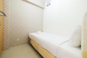 Cozy 2BR Bassura City Apartment with City View By Travelio