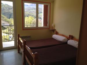 Hotels Les chambres et studios Camping Parc de Paletes : Chambre Lits Jumeaux