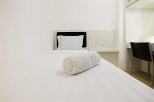 Spacious 2BR Apartment Connected to Mall at Bassura City By Travelio